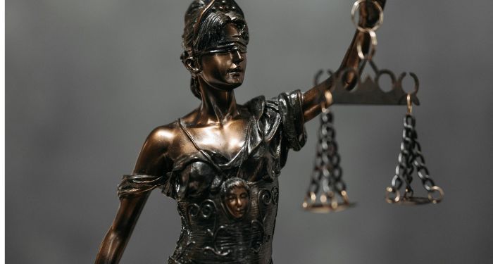 a statuette of lady justice.jpg.optimal